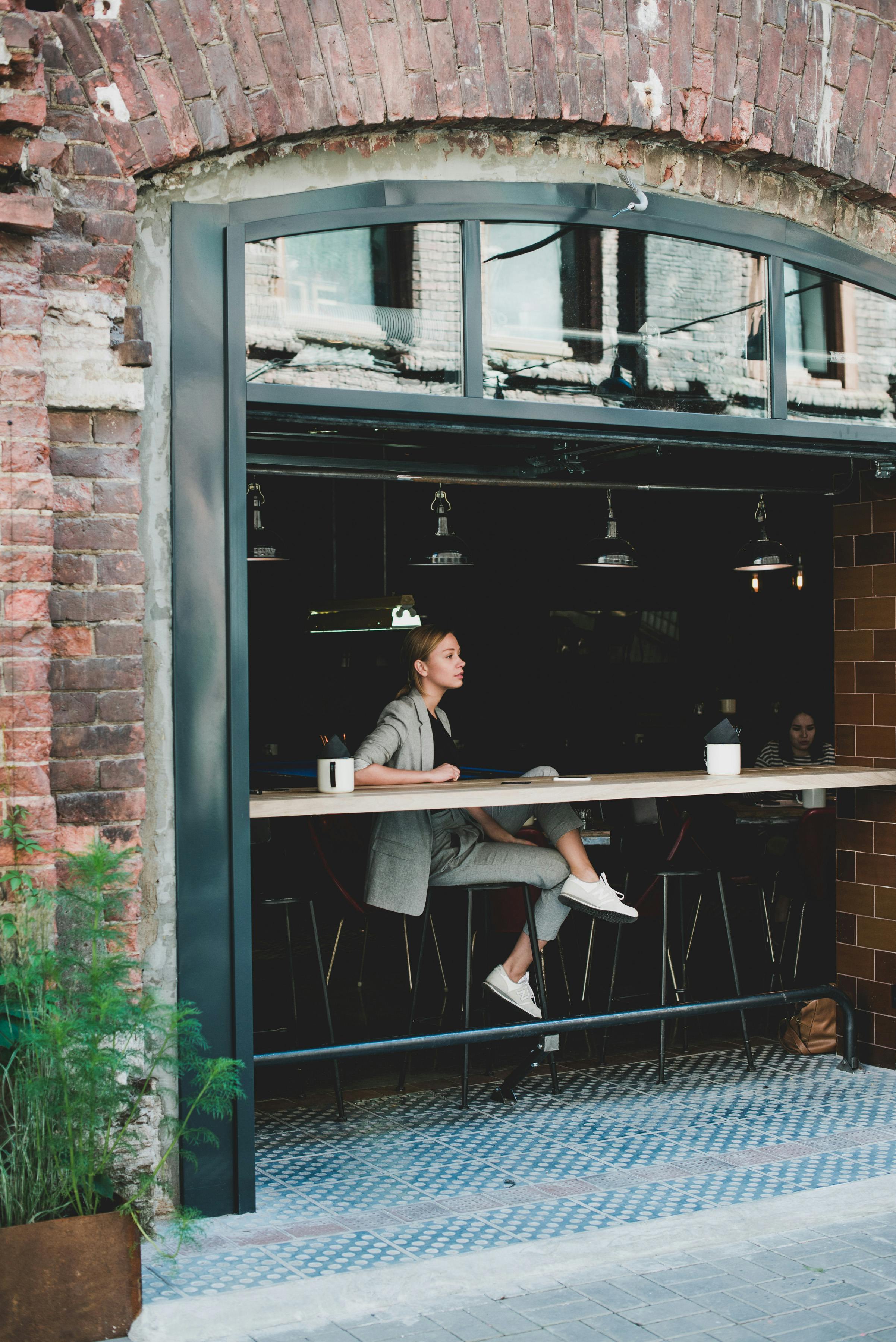 Julia ponders a happy future as she settles into the new business | Source: Pexels