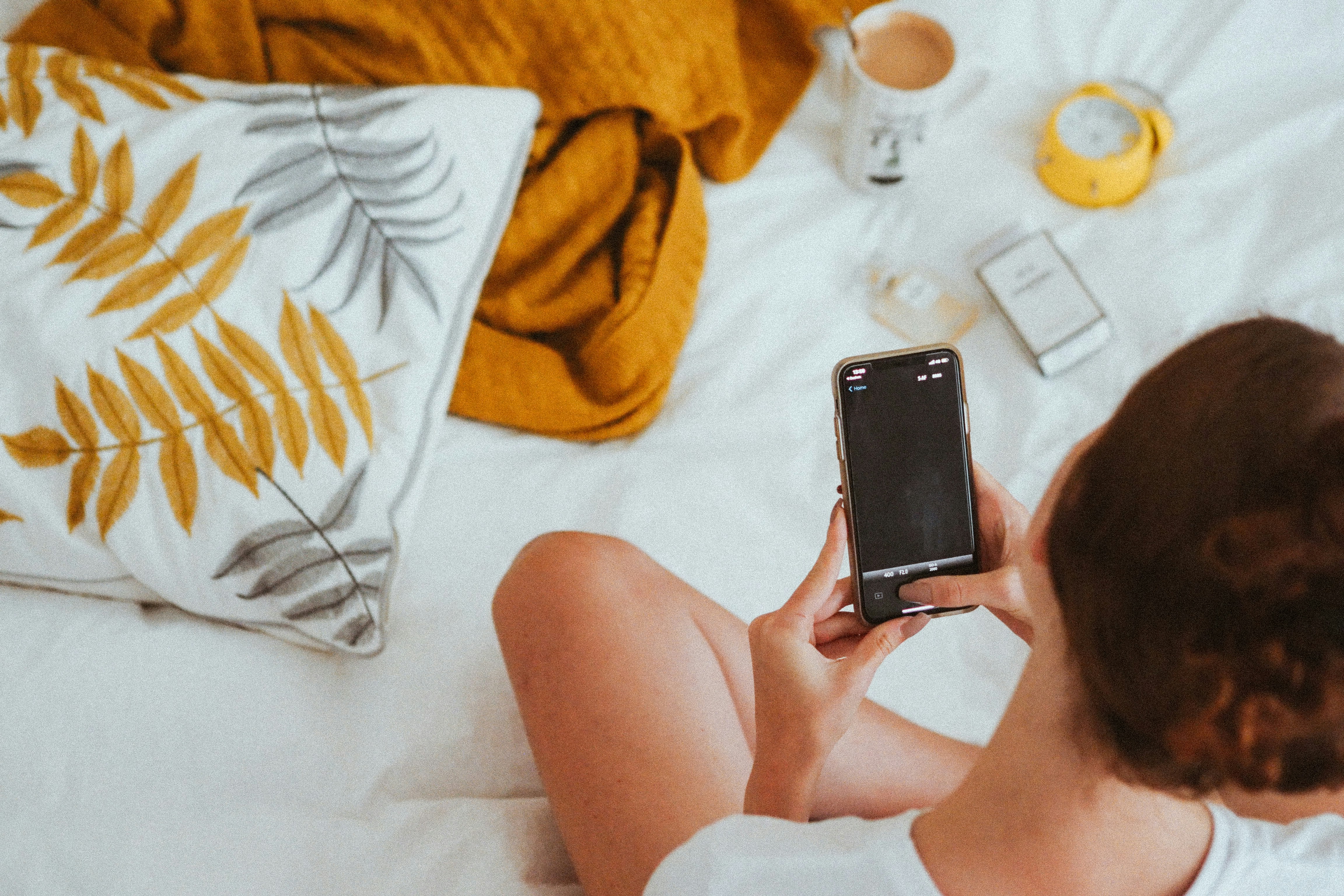 A woman holding her phone | Source: Unsplash