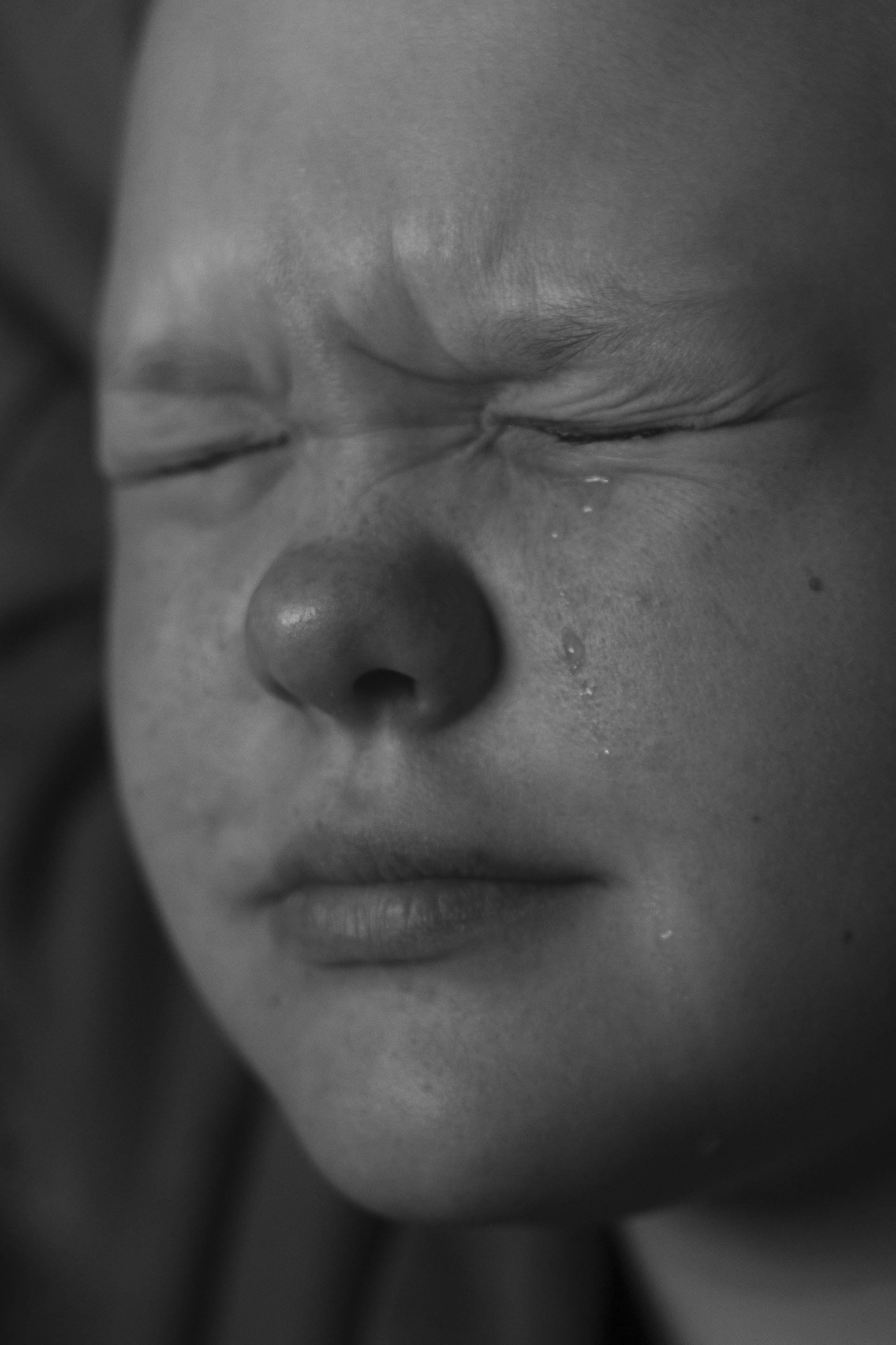 A grayscale shot of a little girl crying | Source: Pexels