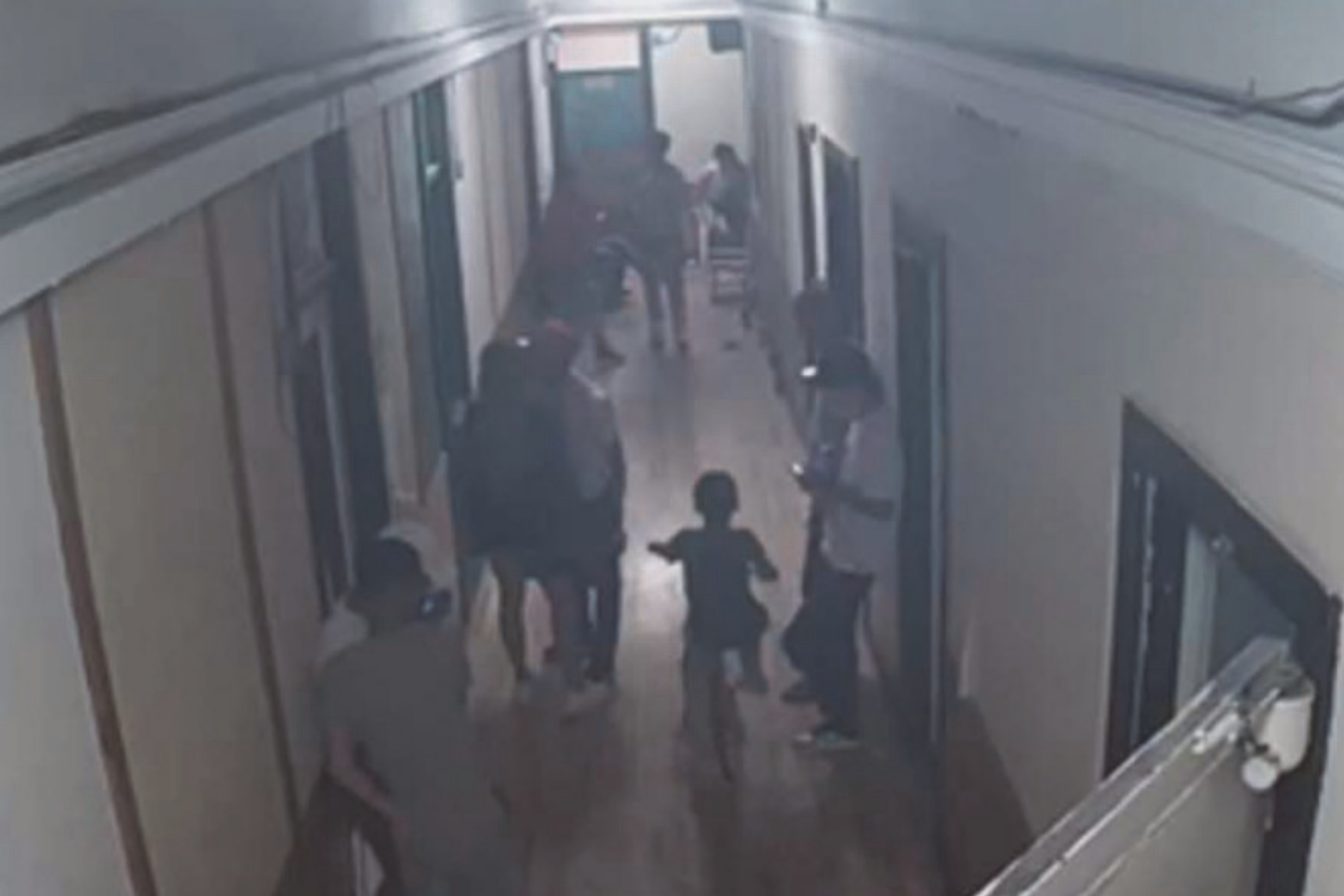 Child Plays In Front of gang