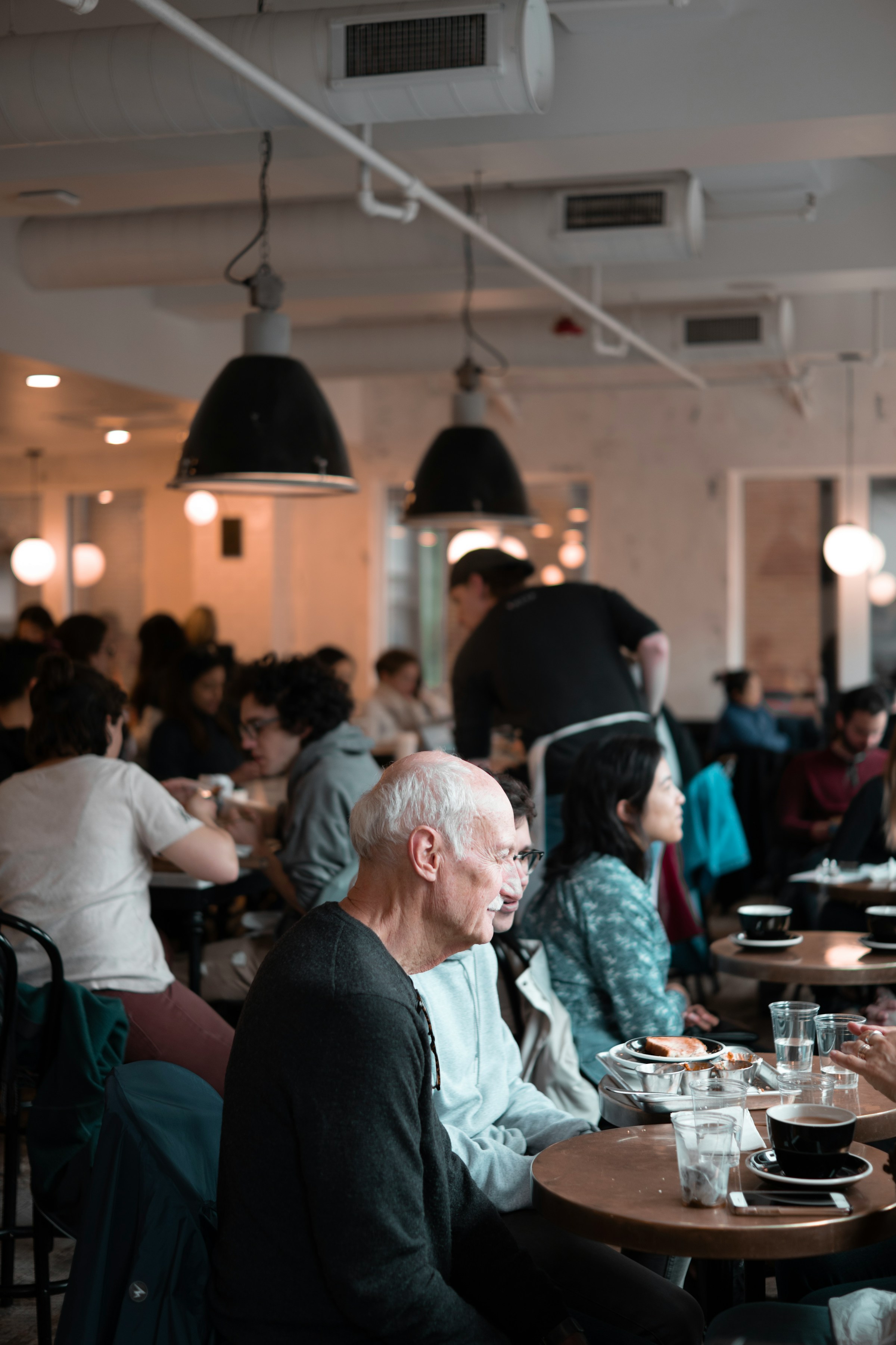 People in a bustling bakery | Source: Unsplash