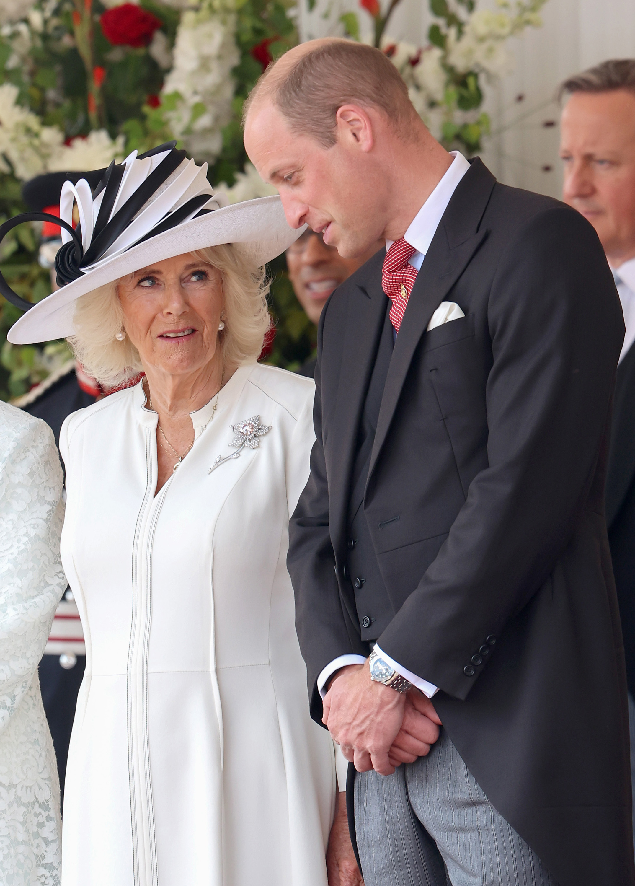 Queen Camilla speaks with Prince William, Prince of Wales at the ceremonial welcome during the state visit to the United Kingdom in London, England, on June 25, 2024 | Source: Getty Images