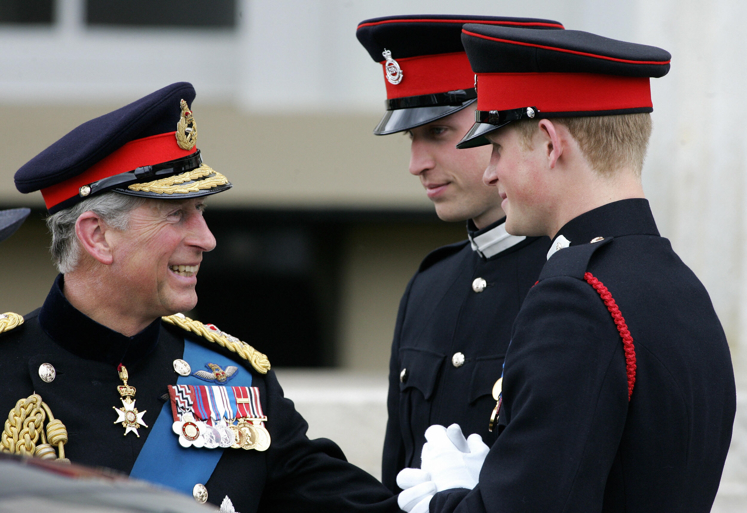 Britain's Prince Charles with Prince William and Harry after attending the Sovereign's Parade at the Royal Military Academy in Sandhurst, southern England, on April 12, 2006 | Source: Getty Images