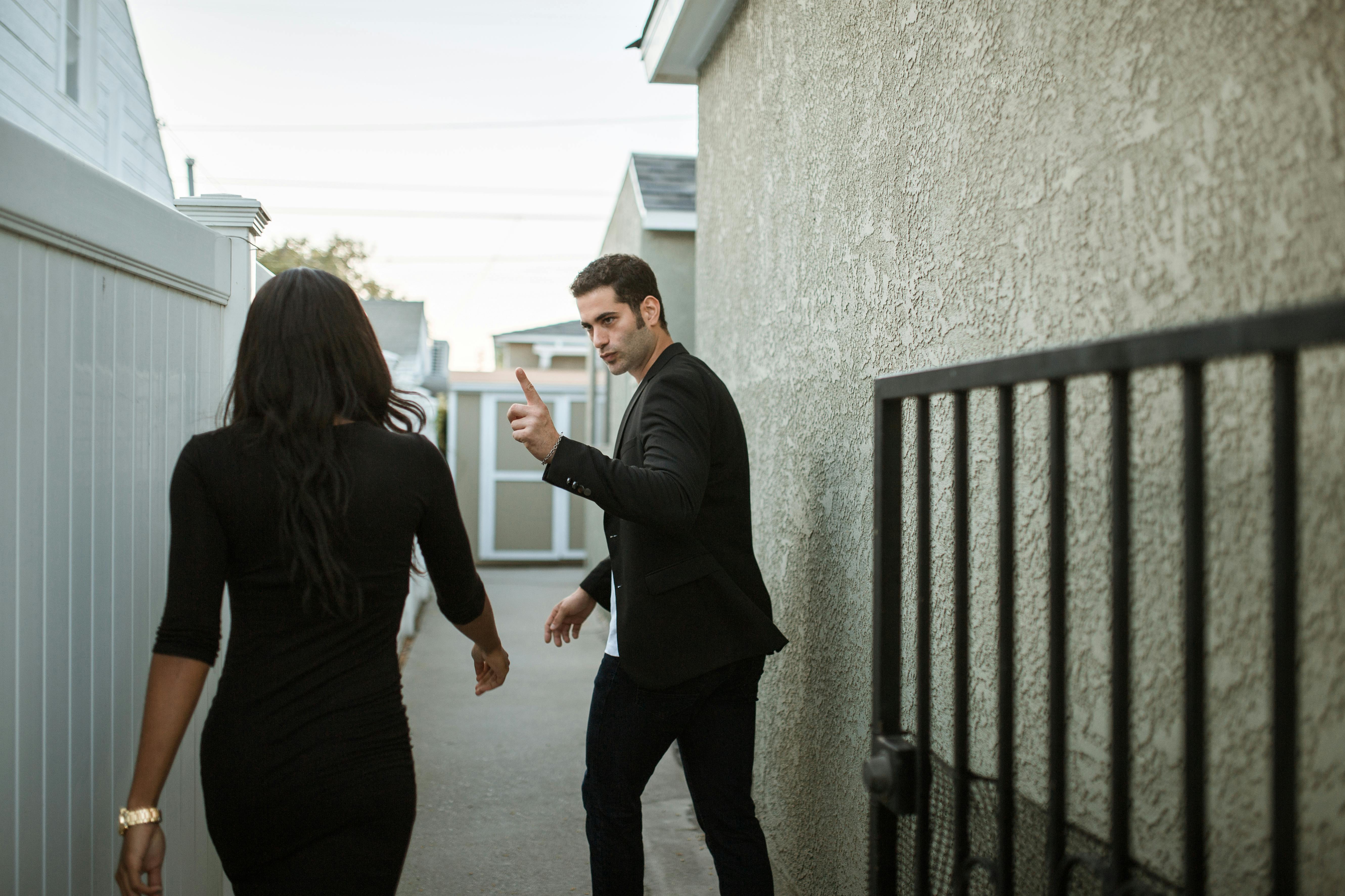 A man pointing his finger at a woman | Source: Pexels