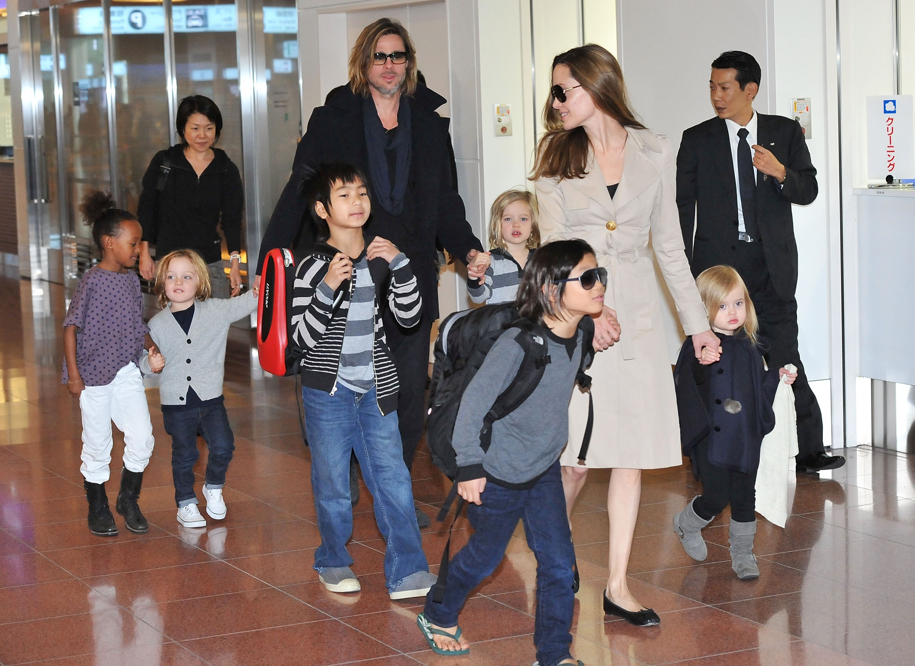 Knox Jolie-Pitt at Haneda International Airport with his parents and siblings on November 8, 2011, in Tokyo, Japan | Source: Getty Images