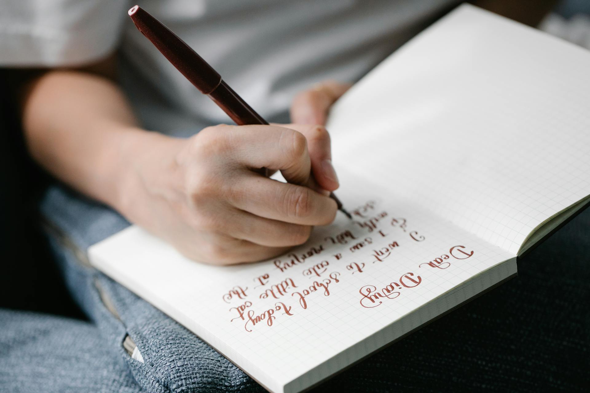 A closeup shot of a person writing a diary | Source: Pexels