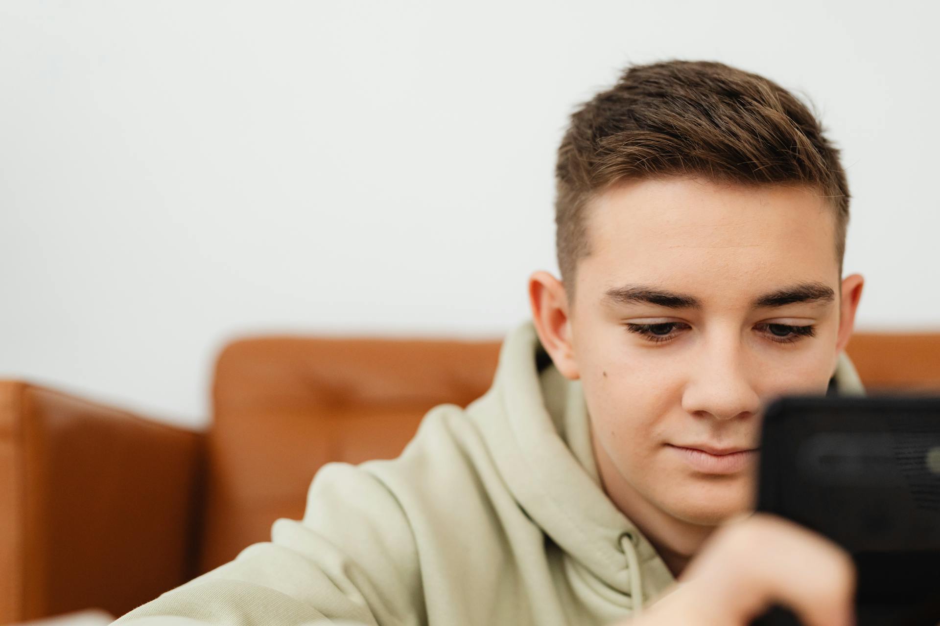 A boy using his phone | Source: Pexels