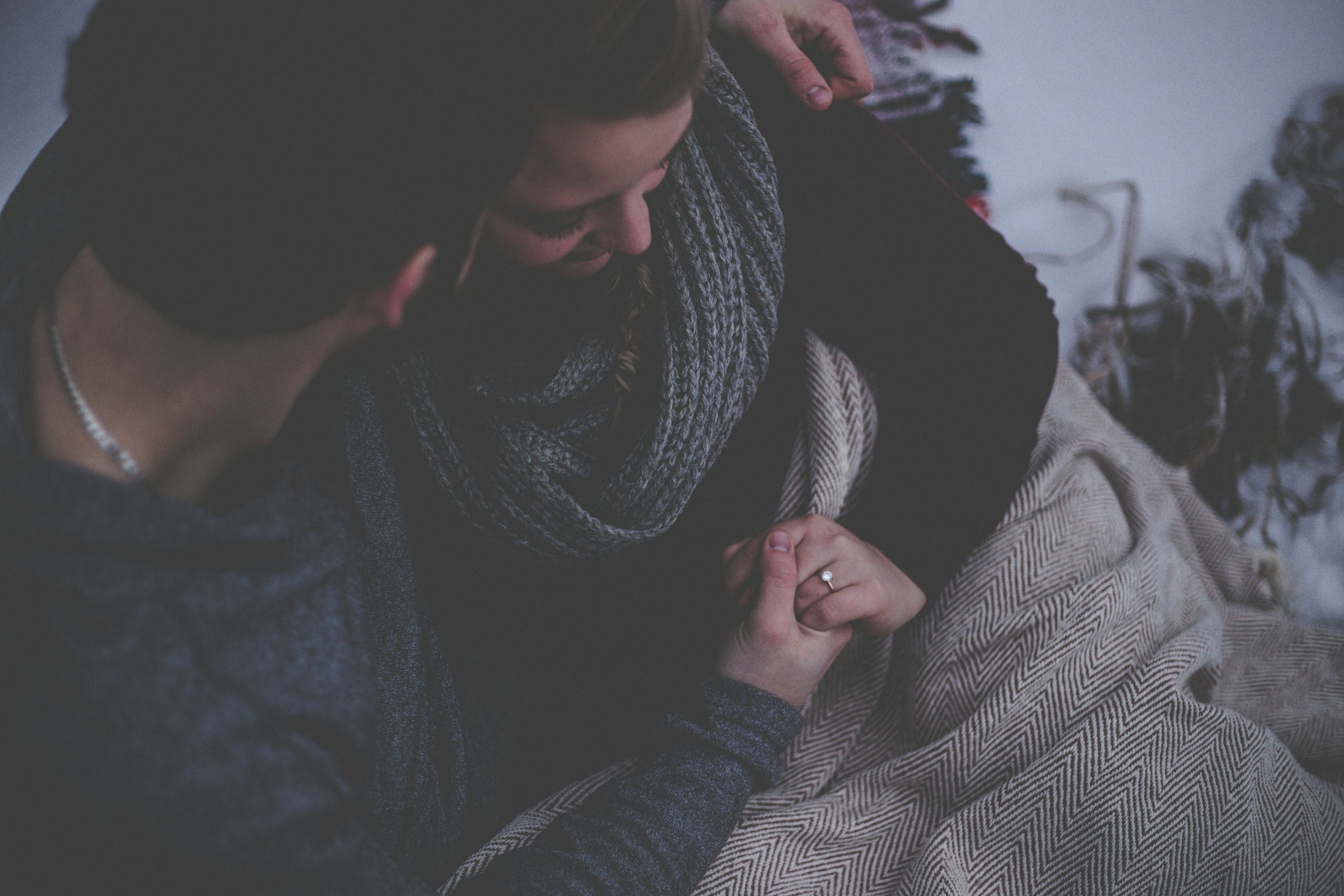 A couple sitting beside each other in a room | Source: Unsplash