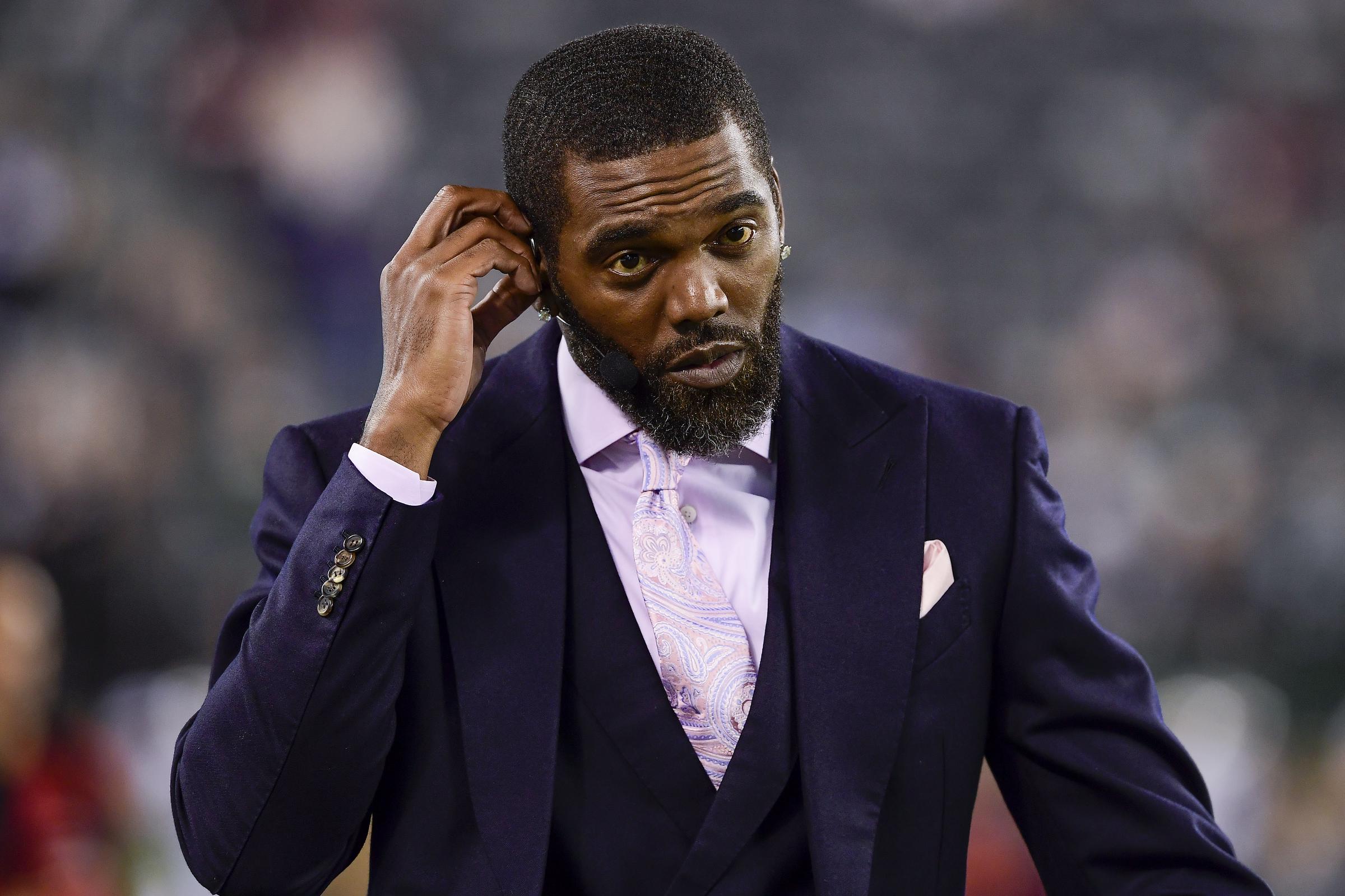 Randy Moss walks on the field prior to the game between the New York Jets and the New England Patriots at MetLife Stadium in East Rutherford, New Jersey, on October 21, 2019 | Source: Getty Images