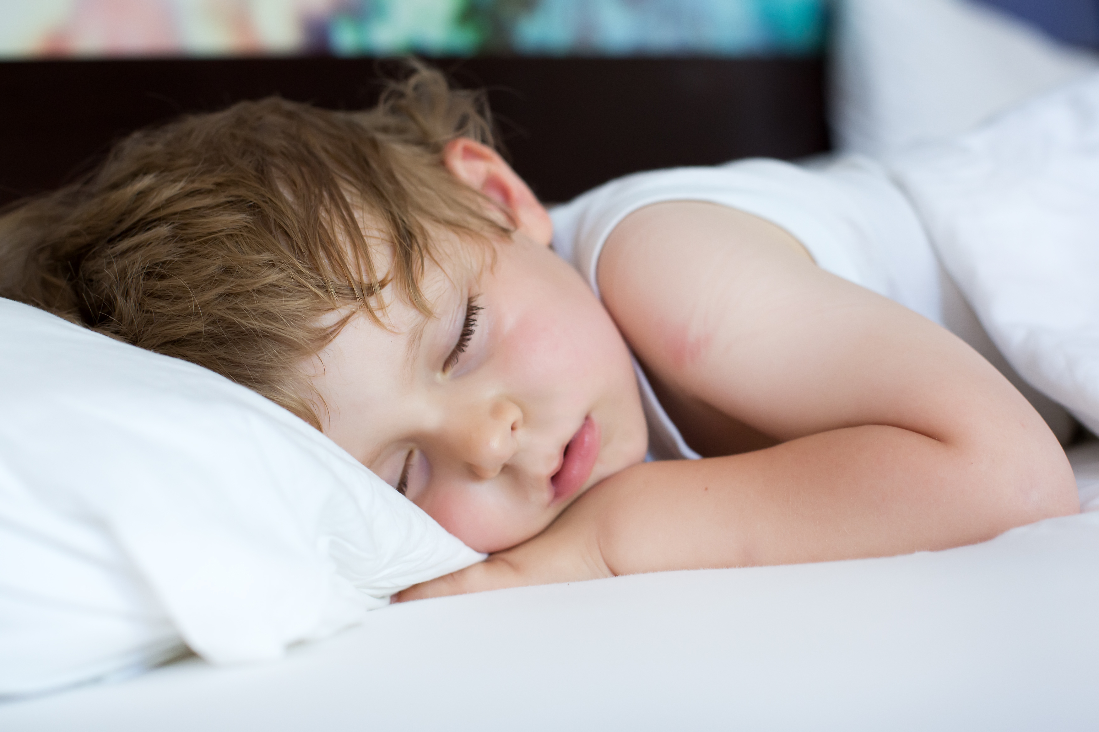 Toddler sleeping in bed