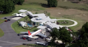 john-travolta’s-florida-home-with-an-airplane-in-the-front-yard,,,