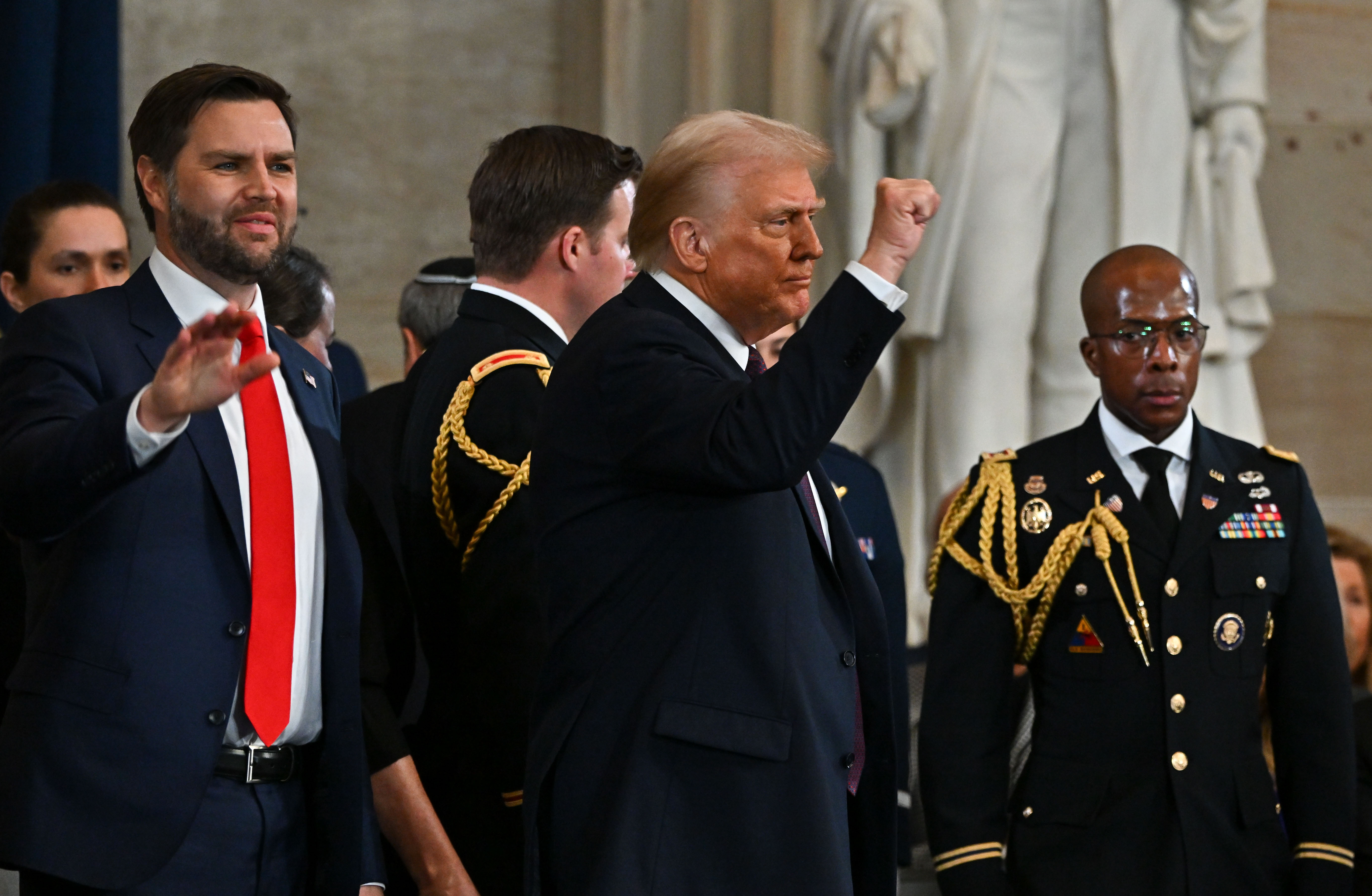 Newly sworn-in President Donald Trump and Vice President JD Vance react at the end of the 60th inaugural ceremony on January 20, 2025 | Source: Getty Images