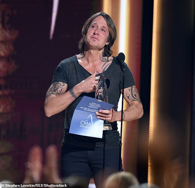 Thank you: This is the second time he has won Entertainer of the Year at the Country Music Association Awards, having previously picked up the trophy in 2005
