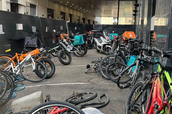 bike store at the migrant hotel filled with courier bikes