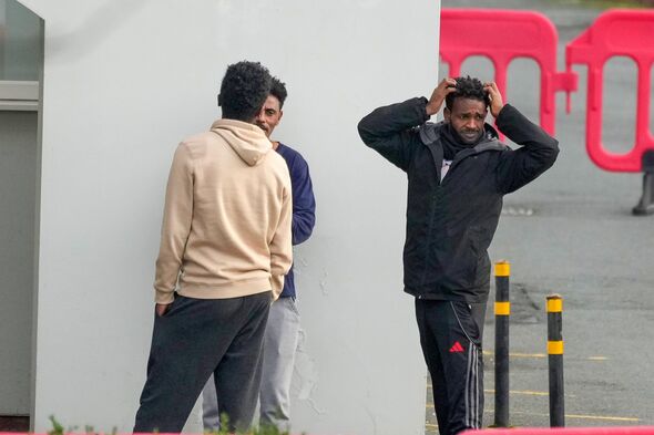 Asylum seekers outside a hotel