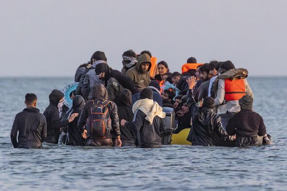 It comes as a brazen migrant was pictured holding an expensive smartphone to film himself